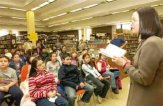 Students from PS 79 listen as Nina Bernstein reads from her new children's book (Photo by Nat Valentine)