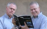 William Rodarmor ('60) posing (both of him!) with his next French translation project of a book about panoramas.